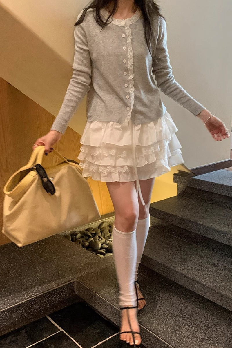 Minifalda blanca con volantes escalonados de talle alto y corte en A