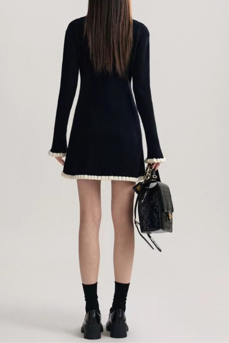 Vestido suéter negro con cuello en V de contraste