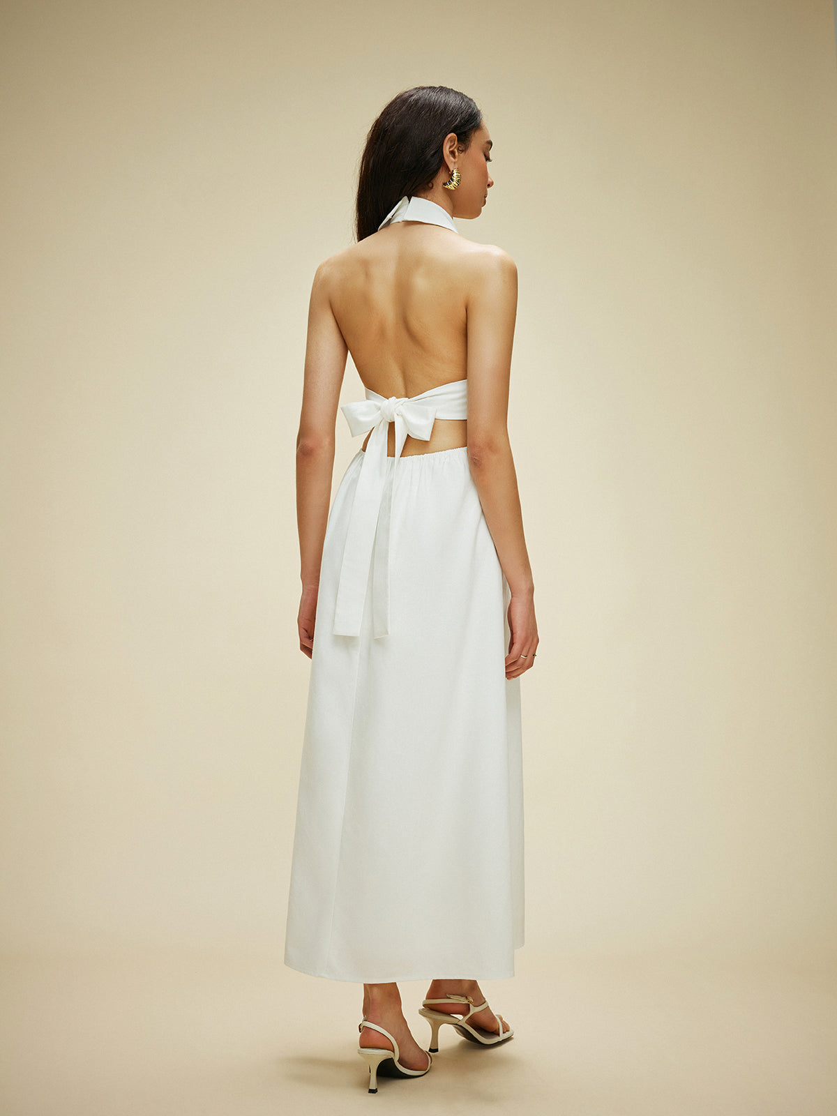 Vestido halter con bolsillos y lazo en la espalda de algodón y lino