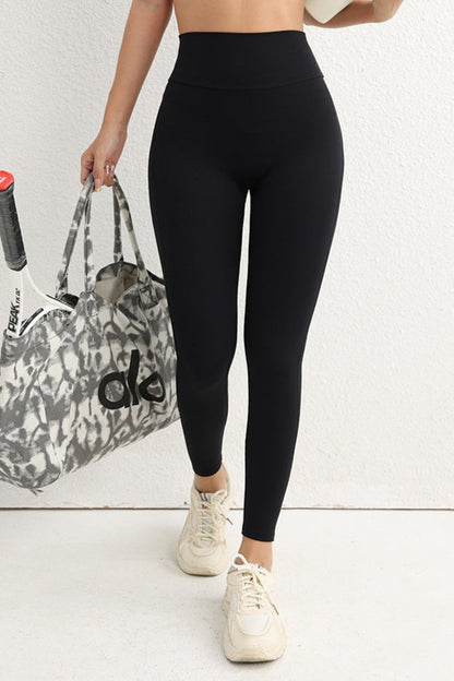 Leggings con botón utilitario de talle alto y efecto push-up