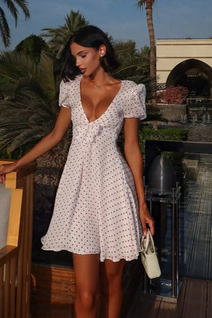 Minivestido sexy con estampado de lunares, escote pronunciado y manga abullonada
