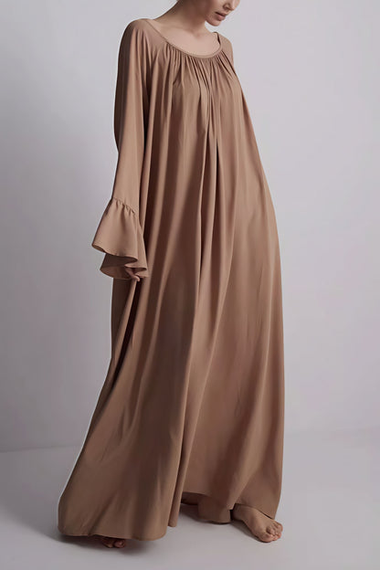 Vestido maxi suelto holgado con bajo acampanado liso