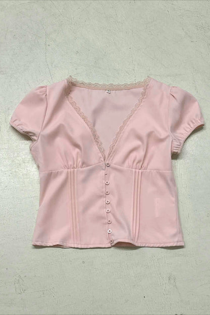 Blusa de encaje con retales, cuello de pico y mangas abullonadas