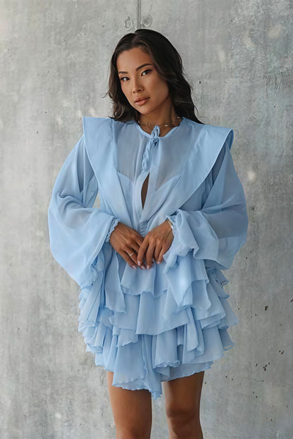 Minivestido escalonado de malla transparente con lazo y manga larga