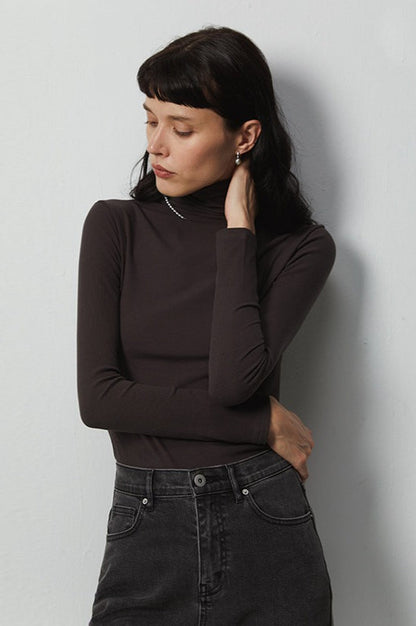 Top de punto elástico térmico con cuello apilado