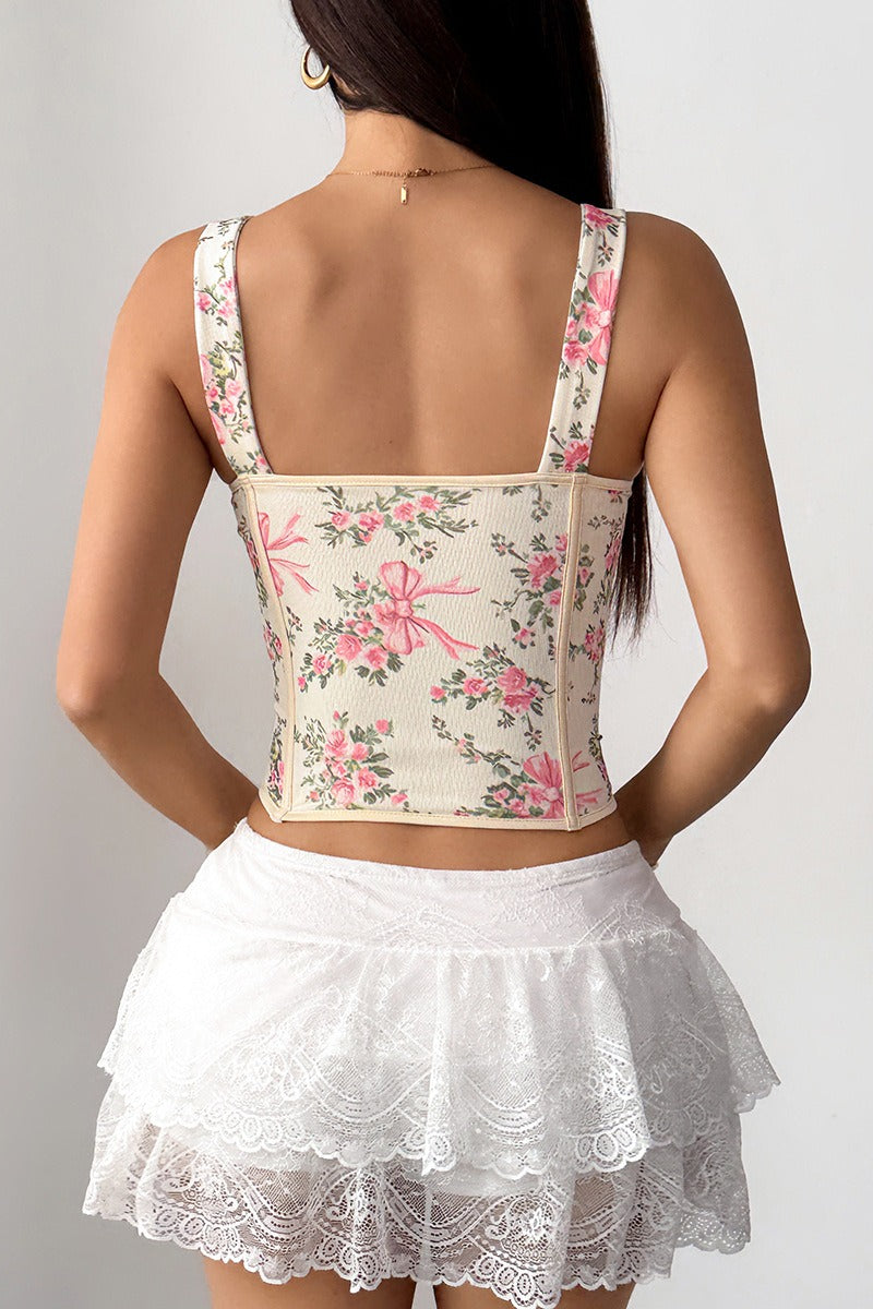 Top corto con estampado floral, varillas, lazo cruzado y lazada