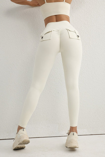 Leggings con botón utilitario de talle alto y efecto push-up