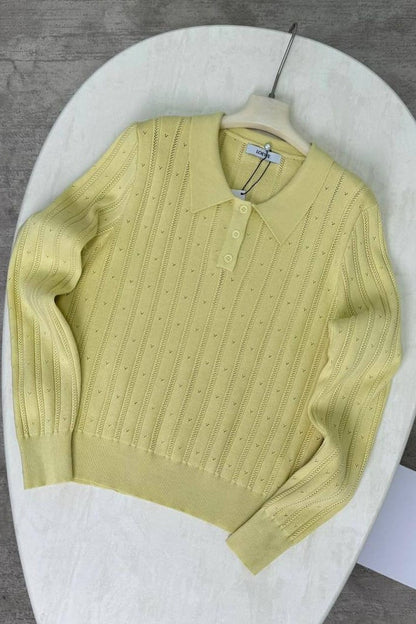 Blusa holgada de manga larga con cuello polo jacquard
