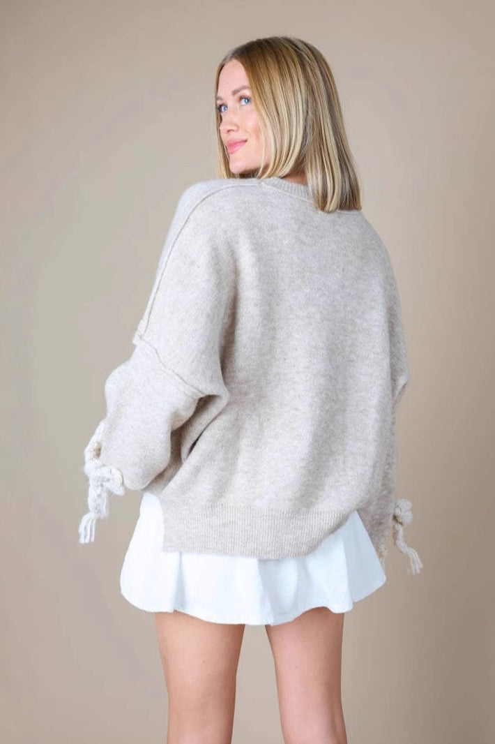 Sudadera holgada con paneles y apliques 3D de lazo