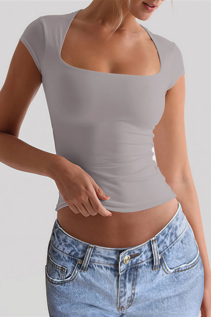 Camiseta crop ajustada con cuello redondo y sin mangas