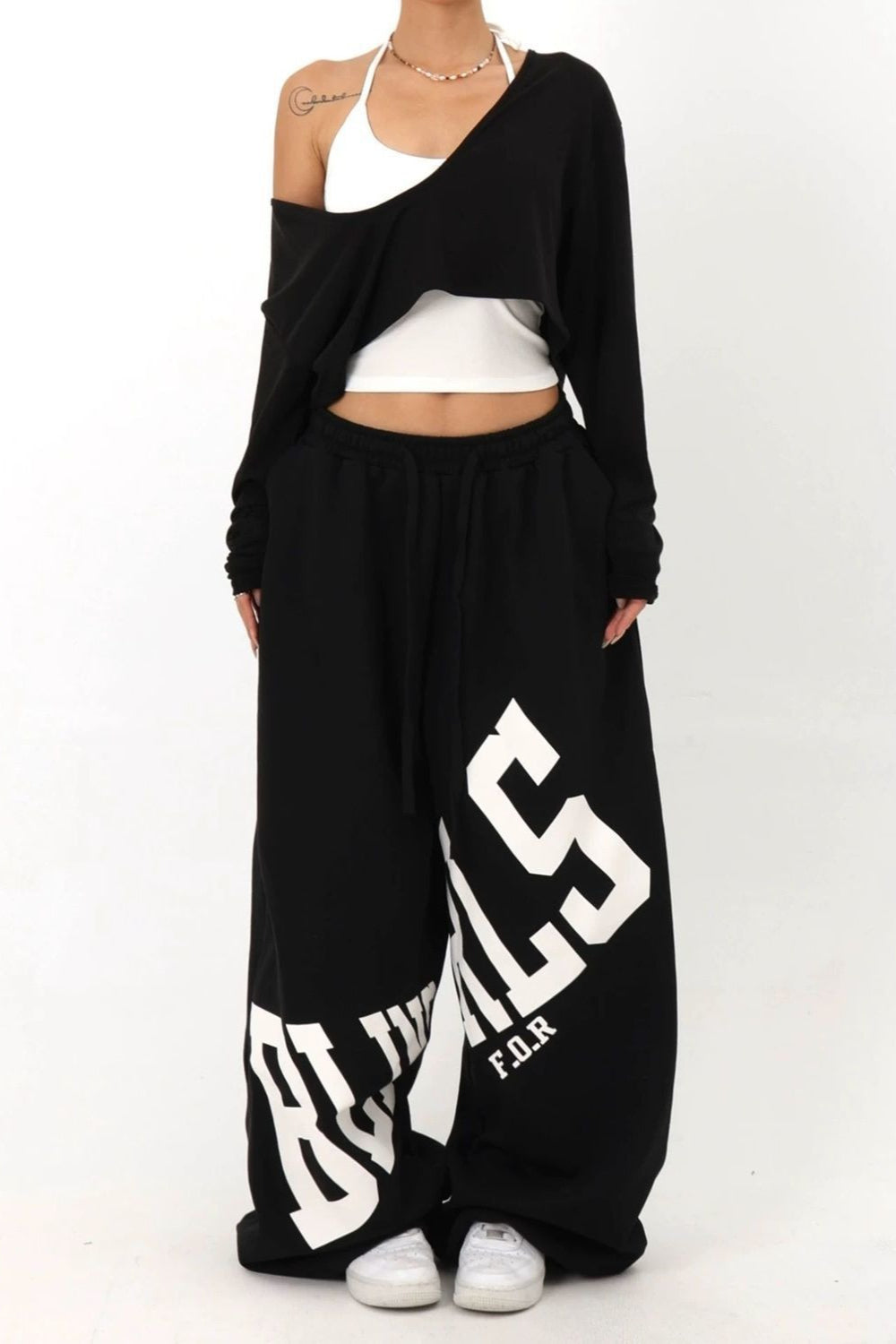 Pantalones casuales sueltos con estampado de letras elásticas