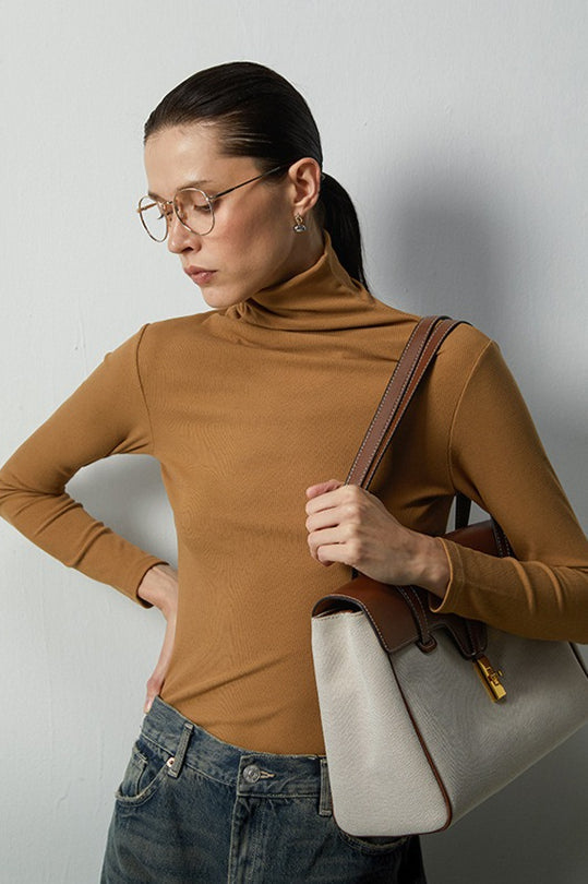 Top de punto elástico térmico con cuello apilado