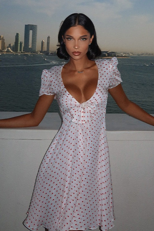 Minivestido sexy con estampado de lunares, escote pronunciado y manga abullonada