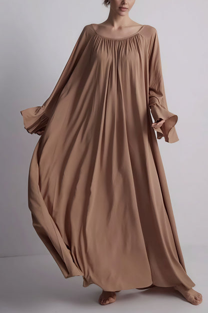 Vestido maxi suelto holgado con bajo acampanado liso