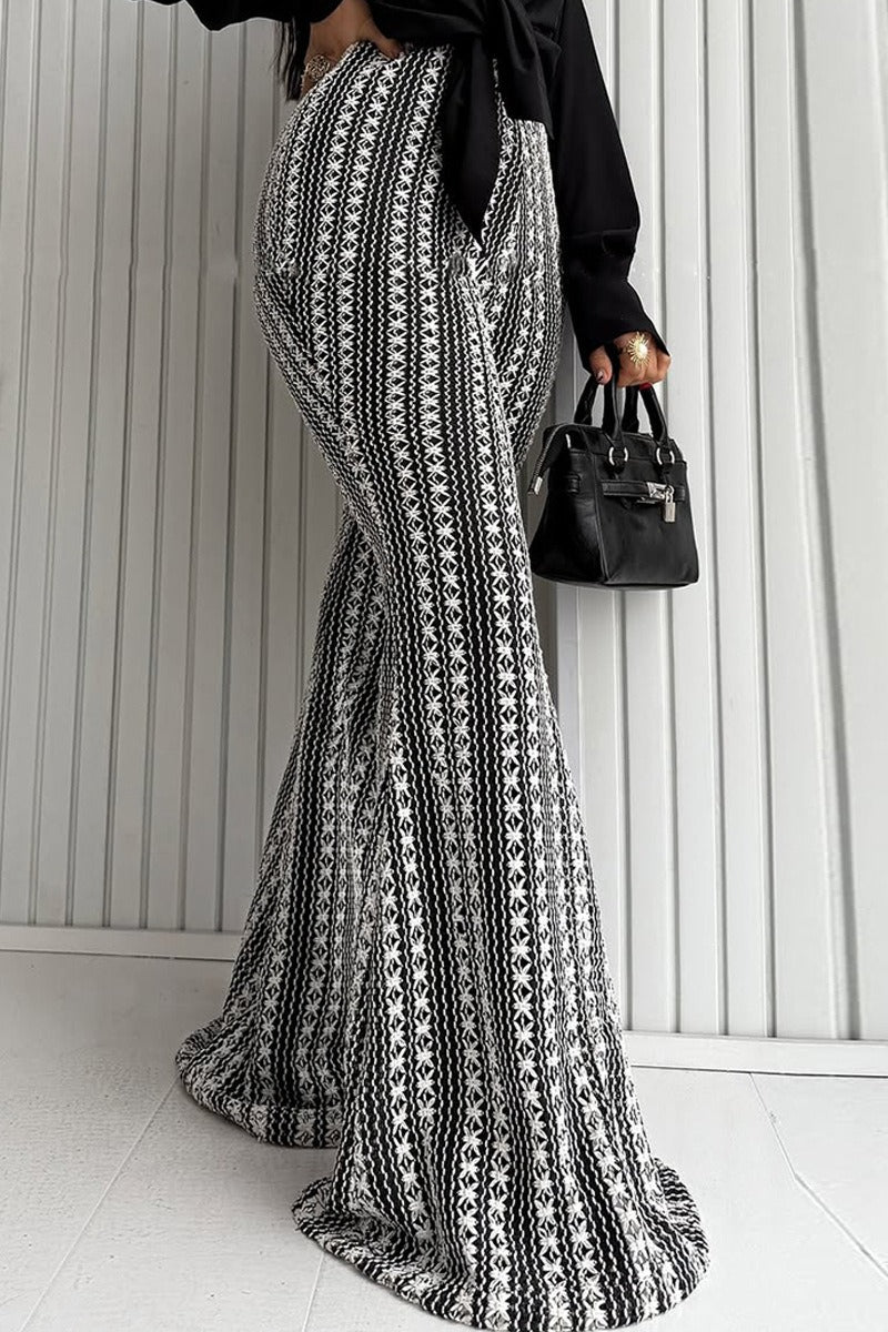 Pantalones acampanados de punto elástico a rayas