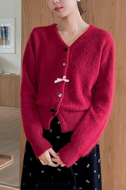 Cárdigan con botones, cuello en V y lazo decorativo