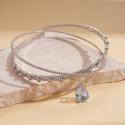 Collar de doble capa con diamantes de imitación de circonita en forma de gota y diseño entrecruzado