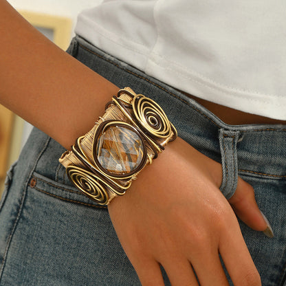 Pulsera abierta de hilo con gema redonda retorcida