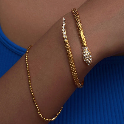 Pulsera abierta de serpiente de circonita de acero titanio chapado en oro de 18 quilates
