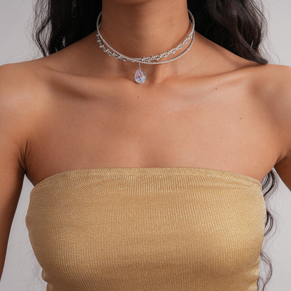 Collar de doble capa con diamantes de imitación de circonita en forma de gota y diseño entrecruzado