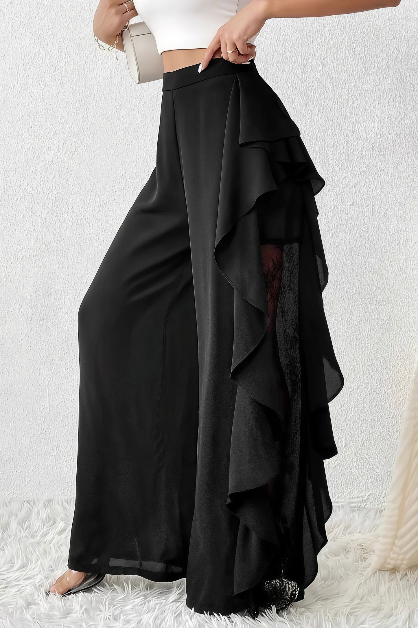 Pantalones de pernera ancha con aberturas irregulares y encaje