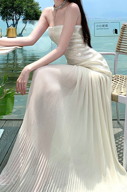 Vestido largo con lentejuelas, sin tirantes y fluido