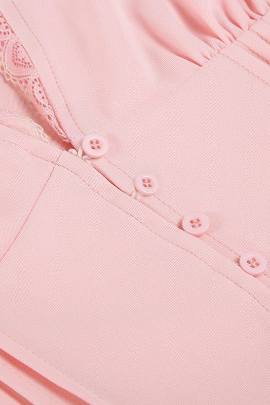 Blusa de encaje con retales, cuello de pico y mangas abullonadas