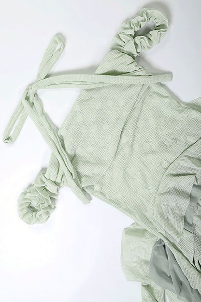 Minivestido fluido halter con borlas y bajo irregular