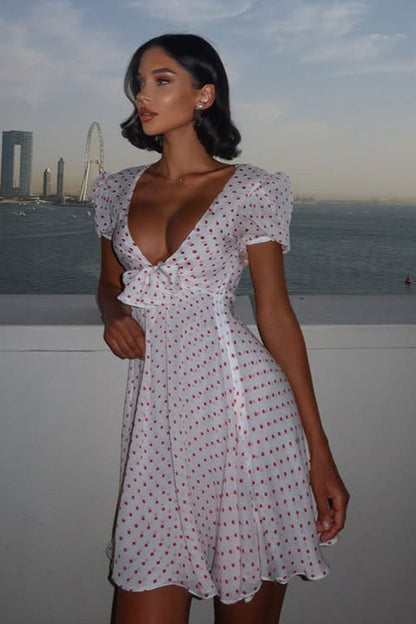 Minivestido sexy con estampado de lunares, escote pronunciado y manga abullonada