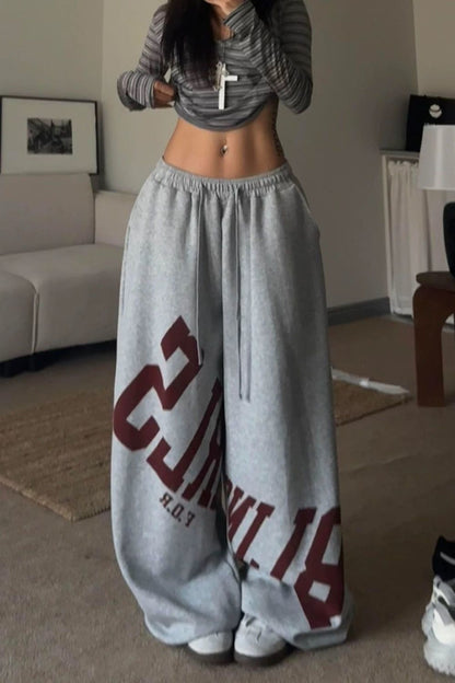 Pantalones casuales sueltos con estampado de letras elásticas