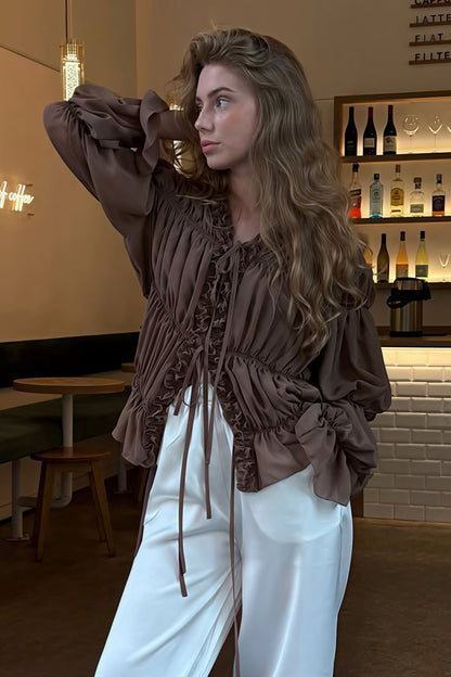 Blusa lisa anudada con volantes y fruncidos