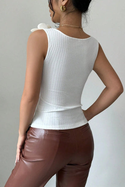 Top de punto con aplique floral